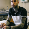 Travis Barker Battles COVID, Root Canal, and Neuralgia Amid Baby Countdown