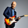 Mark Knopfler Joins Forces with Over 60 Guitar Legends for Charity Single in ‘We Are The World’ Fashion